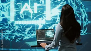 Computer scientist in startup doing advancements in AI field. Woman working on laptop in cutting edge workspace featuring artificial intelligence and neural network systems, camera A