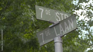 Street name sign against trees in city - Johannesburg, South Africa