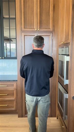 Schneider Builders Inc. on Instagram: "Did this simple moment make you smile? 🚪 This audio is intense, but we’re not joking. The grocery door between the garage and the pantry is life-changing. Try it for yourselves! We’ll build your home and you can let us know what you think of it. Also those hidden pantry doors 🤩🤎 #customhome #kitchendesign #customkitchen"