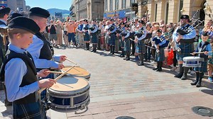 The City of Inverness Youth Pipe Band entertaining crowds, as they prepared for the start of the 2025 Inverness Classic Car Show parade. This was on Saturday 17th May 2025 as the band and vehicles lined up along Inverness High street, with the band playing Steamboat and Bonnie Dundee here. These lovely vehicles, including the Model T Ford at the front, had been displayed around the City centre during the day, thanks to the work of Inverness City Centre BID. #inverness #vintagecars #invernessyout