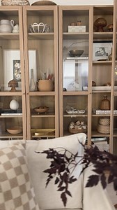 Lindsay Paulson on Instagram: "Styling the IKEA Billy bookcase ✨ Info: (2) @IKEA Billy Bookcases w/ glass doors Color: Oak Effect Article number: 105.089.32"