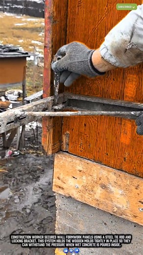 Worker Locks Concrete Formwork Panels Using a Steel Tie System