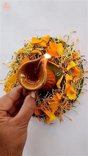 Made this quick and beautiful diya decoration using banana leaf and marigold flower petals 🌿🪔 Simple, traditional and perfect for any puja or festive moment ✨ Follow for more easy craft ideas! #DiyaDecoration #PujaCraft #BananaLeafArt #fblifestyle #MadeByKaushika #christmasdecor #christmasdecorations #festivedecor #pujadecor | Made by Kaushika