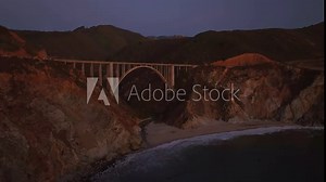Bixby Bridge Big Creek Pfeiffer Canyon Santa Lucia Mountains Big Sur California aerial drone stunning sunset Pacific Ocean Coastal Highway windy road rugged coastline Carmel Sea Monterey upwards slow