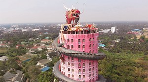 118K views · 3.4K reactions | An enormous dragon scales the walls of the 17-story Wat Samphran Temple, which is rarely featured in guidebooks and is considerably removed from the typical tourist track. The dragon itself is hollow, and you can walk the entire length of the tower inside its body. | Atlas Obscura | Facebook