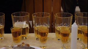 Glasses with beer and shot glasses with rum on a table in a pub