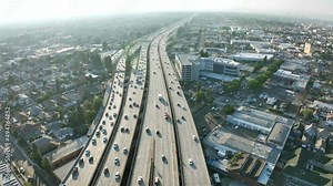 Aerial view Los Angeles freeway, cars and trucks on road traffic on highway to downtown LA. urban modern city in USA, travel destination in America. Drone 4k.