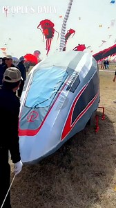12K views · 311 reactions | The 40th Weifang International Kite Festival goes in full swing in east China's Shandong. Bullet train, marine creatures, aircraft carrier…everything can fly in the hands of kite flying enthusiasts here. | People's Daily, China | Facebook