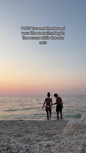 Romantic Sunset Swim: Couples Enjoying Ocean Love