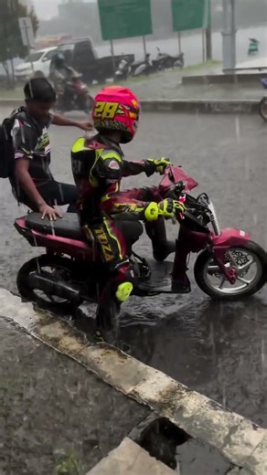 Motorcycle Riders Brave The Heavy Rain Storm