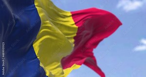 Detail of the national flag of Chad waving in the wind on a clear day.
