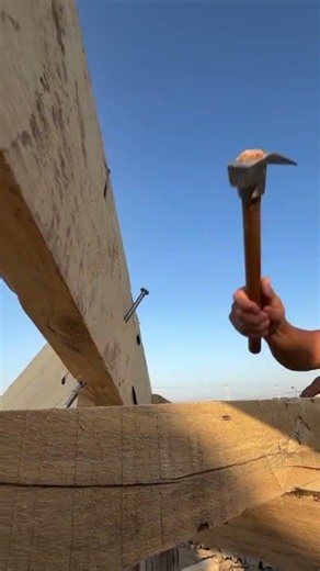 the process of installing large nails using a square head hammer #construction #nails #hammer