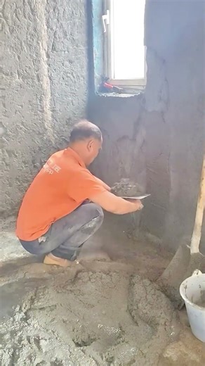 applying cement plastering to walls for home renovation projects using professional construction
