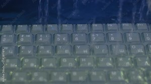 Protective, resistant, safety, technology concept. Keyboard of waterproof rugged laptop computer for military, outdoor and industrial use during shaking, water resistance test - heavy rain - close up