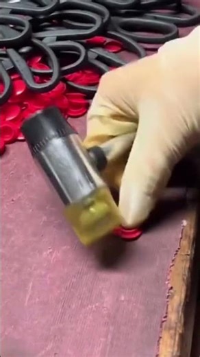 The process of making scissors in large quantities by a worker in a large factory