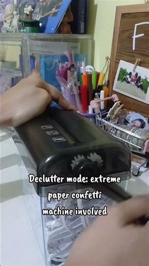 decluttering paper with shredder