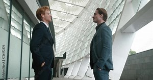 Confident handshake between two men emblem of cooperation. Cooperation born from this handshake signifies shared vision Cooperation fortified by handshake sets foundation for future success.