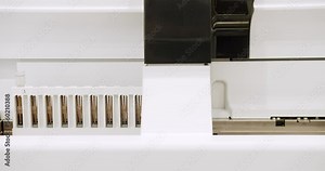 Blood Testing Machine Checks Samples In A Laboratory Room. Automated machine in work process, blood and urine sampleanalysis. Bio lab medical clinic chemical automatic analyzer.