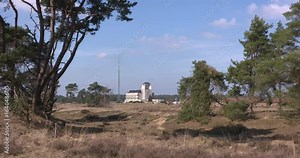RADIO KOOTWIJK Building A and transmission mast of the former (1920s) Dutch radio communication facility ,located on the Kootwijkerzand nature reserve. NETHERLANDS - MARCH 2017