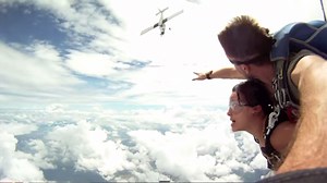 Harrowing moment when plane nearly collides with skydivers mid-air