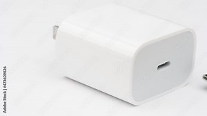 Close up of lightning port connector system or connection interface isolated on white background. Transfer information or charge for digital camera gadget smartphone or laptop.