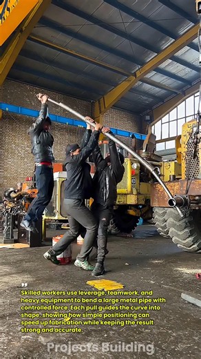 Heavy Pipe Bending Teamwork in the Workshop