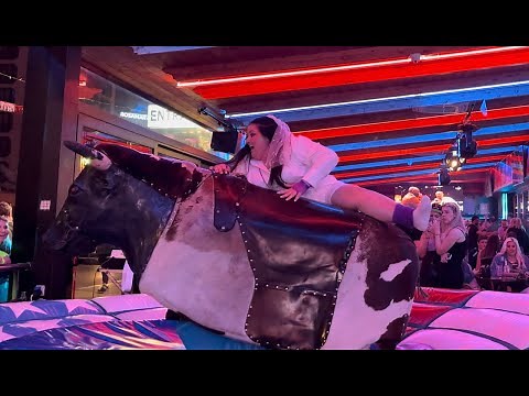 Pretty Girl in White Dress Riding on a Bull in Benidorm | Mechanical Bull Riding in 4K