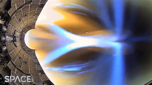 Watch this spectacular video that captures a fiery re-entry of SpaceX's Falcon Heavy
