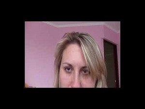 Woman sneezes a lot and blowing her nose in handkerchief