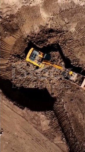 Excavator during clay mining in open-pit