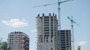 High-Rise Building Under Construction with Cranes | Premium Stock Video Footage