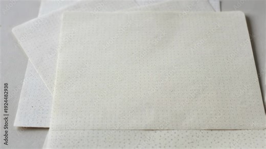 Medium shot of dot grid notebook sheets revealing subtle dot patterns for flexible layouts bullet journaling and creative freedom in planning.