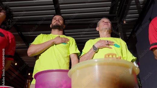 Soccer fans singing a national anthem at a stadium