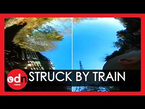 Police Officer Survives Being Hit by a Train in Incredible Video