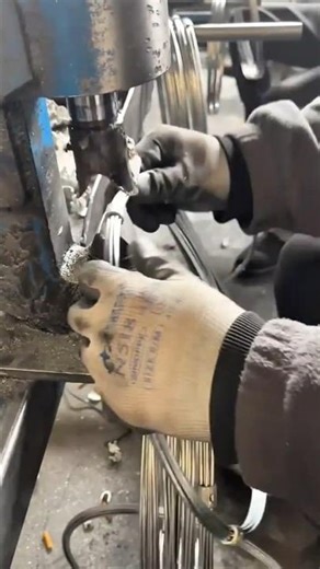 bending metal wires manually using a professional machine for industrial work