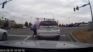 Video: Woman run over by her own car walks away
