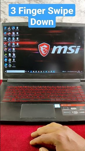 How to quickly minimize all open apps with touchpad on a Windows laptop