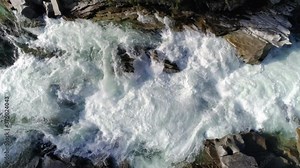 Slow Motion 4K Whitewater Rapids Raging Over Waterfall Rocks from Overhead Aerial
