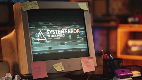 clip-4010576959-system-error-message-on-retro-monitor-computer