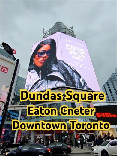 Dundas/Sankofa Square in motion.Screens, crowds, crossings • Toronto at full volume.