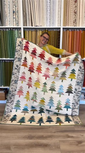 Edyta Sitar on Instagram: "“It’s never too early to start stitching a little holiday magic. 🌲✨ This forest quilt makes every day feel festive and cozy.” 🧵 Hashtags: #HolidayQuilt #CozyVibes #HandmadeHolidays #QuiltLove #SewingJoy #QuilterLife #ModernQuilt #ChristmasCrafts #HolidayDecor #CozySeason #StitchByStitch #QuiltInspiration #WinterMakes #SewHappy"