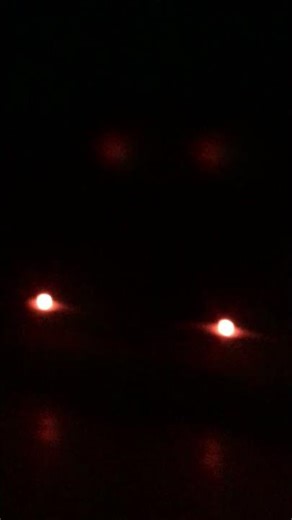 My toy railroad crossing gate at night