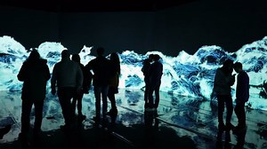HELSINKI, FINLAND - JAN 06, 2019: "Massless" Exhibition - immersive interactive graphic digital installations by Japanese artists TeamLab at Amos Rex Museum. Visitors enjoy the new modern digital art.