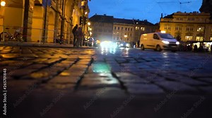 Czech Republic. City of Prague. Cars drive through the streets of the city in the evening. Shooting from road level. Time lapse