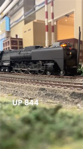 Ho model Union Pacific 844 hauling an excursion train