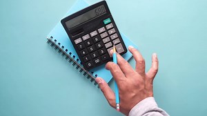 Slow motion of man hand using calculator