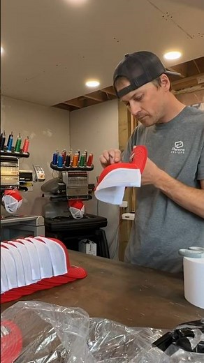 Powering through 600 hats on 3 Melco embroidery machines.