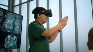 clip-3513061999-young-doctor-using-virtual-reality-headset-training