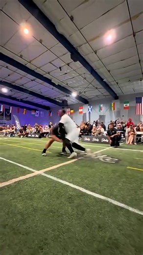 Rugby players are just an different breed and he is on his flip flops?!?! Haha (Guy in Black is the Rugby Players)