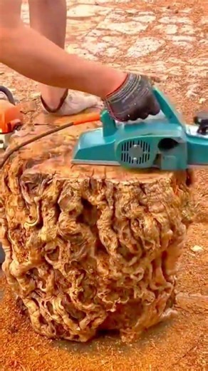 smoothing large wood surface using an electric hand planer machine for woodworking and carpentry